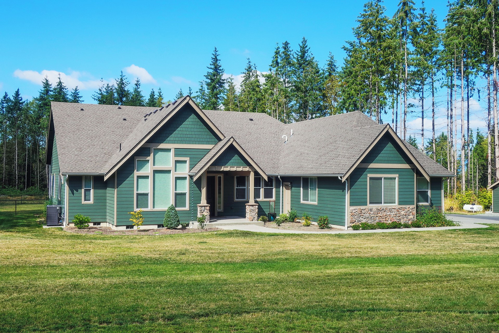 Luxury Single Story Home Exterior Surrounded by Trees