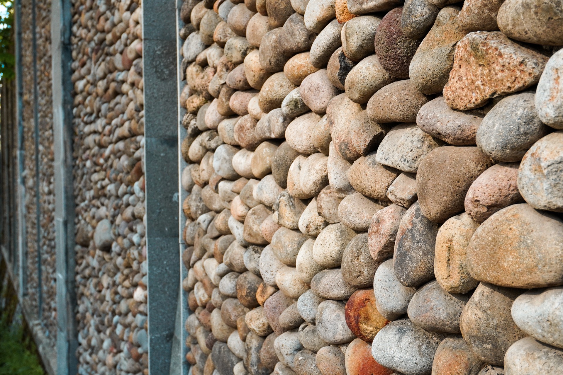 Stunning aesthetic wall made of arranged stones with iron braces